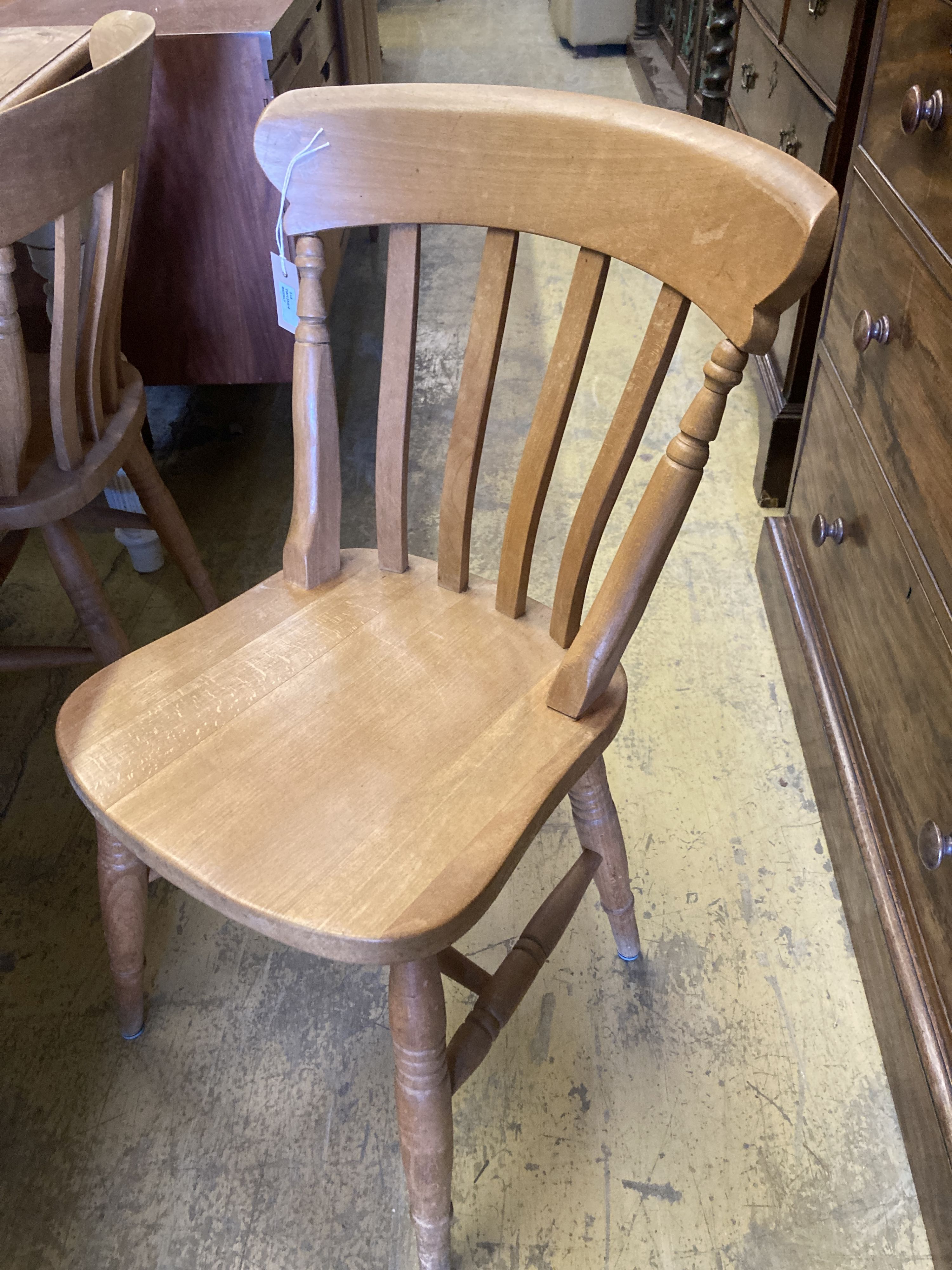 A Victorian style rectangular painted pine kitchen table, length 150cm, depth 90cm, height 79cm and four Windsor beech lathe back kitch